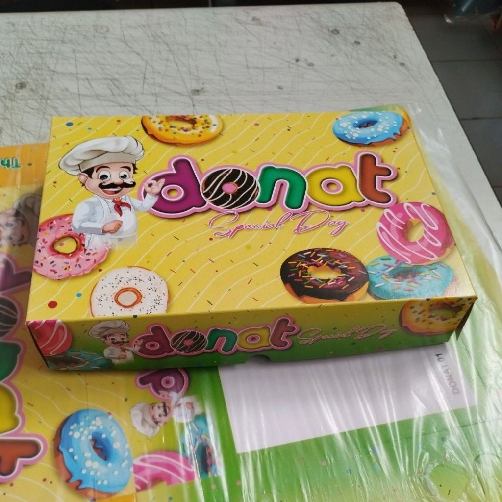

Dus Donat Laminasi Ukuran 27x18,5