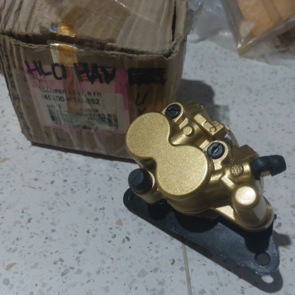 Caliper Assy cakram bawah Honda Supra X125 lama original 45200-KTM-852