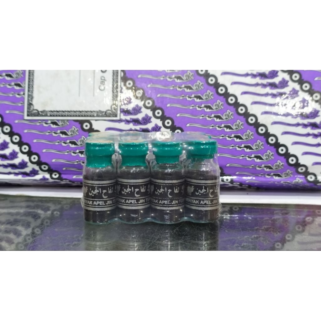 minyak apel jin hitam segel hijau asli