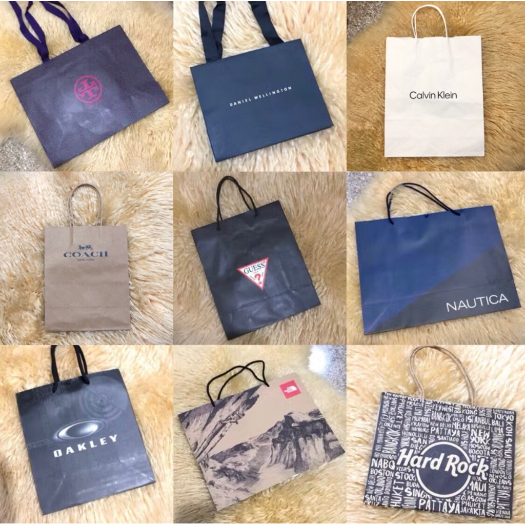 

Paper Bag Branded Authentic Calvin Klein, Coach, Tory Burch, Daniel Wellington, Guess, Oakley, Nautica, North Face, Hardrock, Banana Republic, Karen Millen Kotak Kado Gift Bag