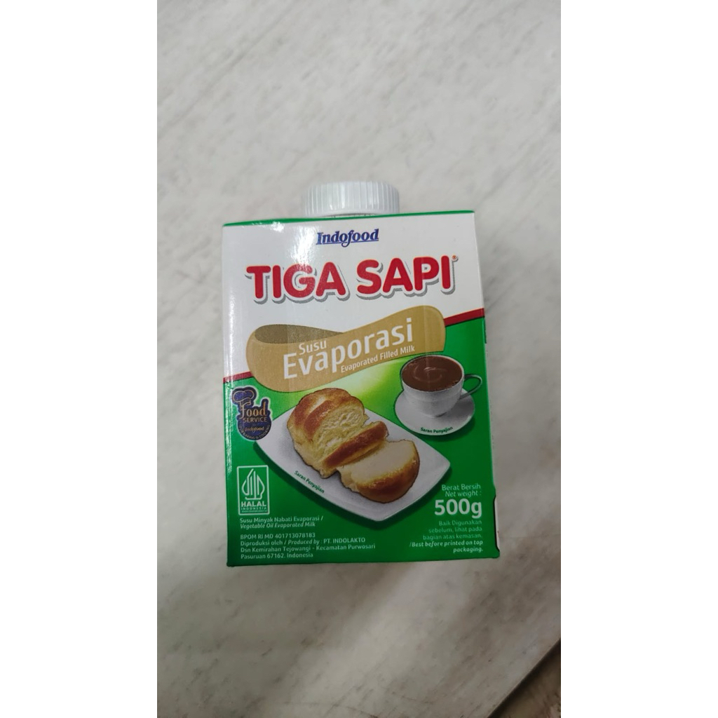 

Tiga Sapi Susu Evaporasi 1pcs