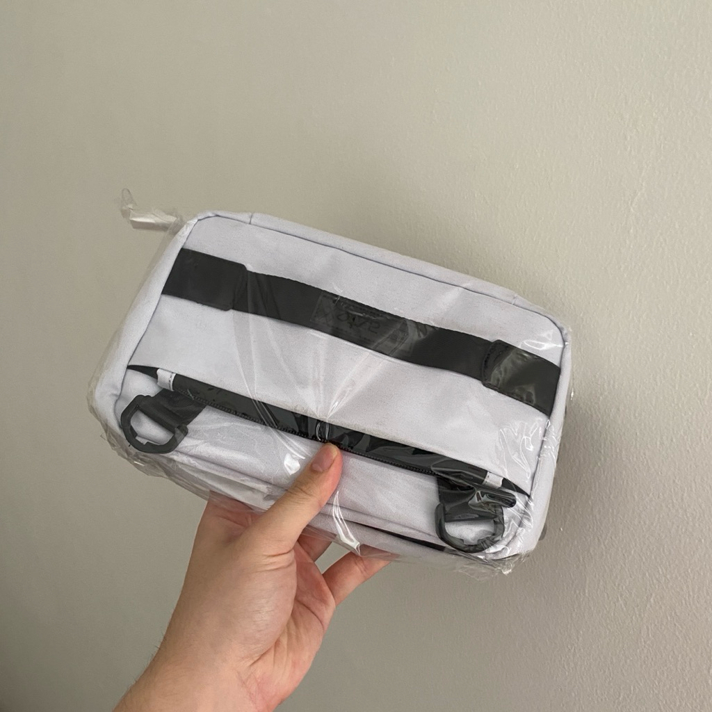 Tas clutch bag RUSEL CO ex pemakaian uda dilaundry warna putih