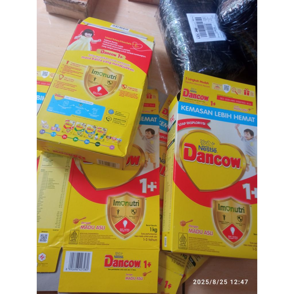 

kardus bekas susu dengan kode unik