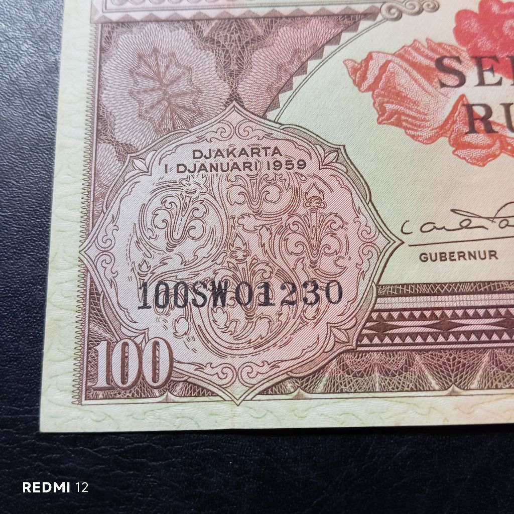 uang kertas seri cantik SW01230 100 rupiah bunga tahun 1959 baru utuh asli
