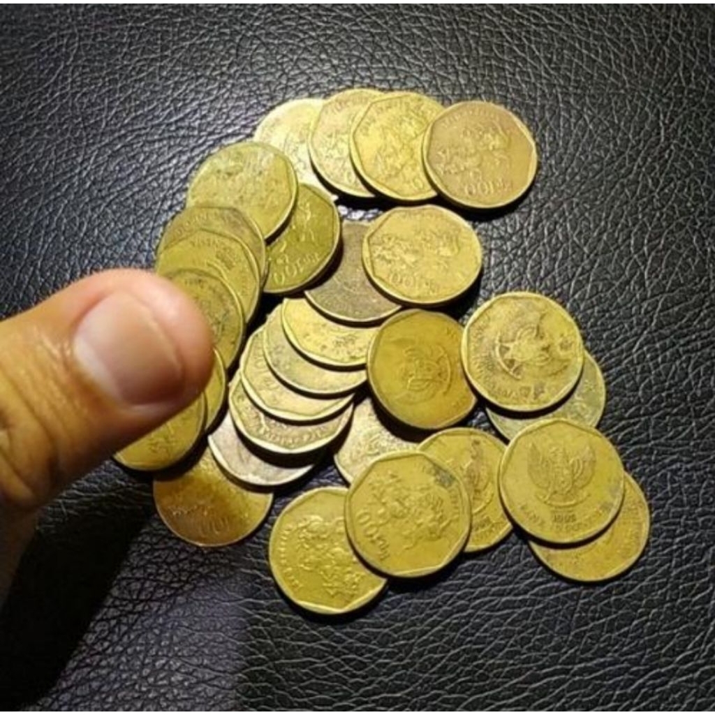 uang koin kuno 100 rupiah karapan sapi kuningan