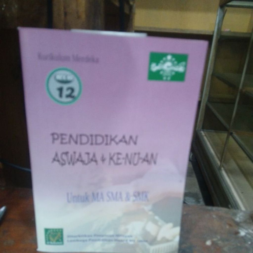 Buku paket PendidikanAswaja& ke- nu- an untuk ma sma& smk kelas 12 kurikulum merdeka .