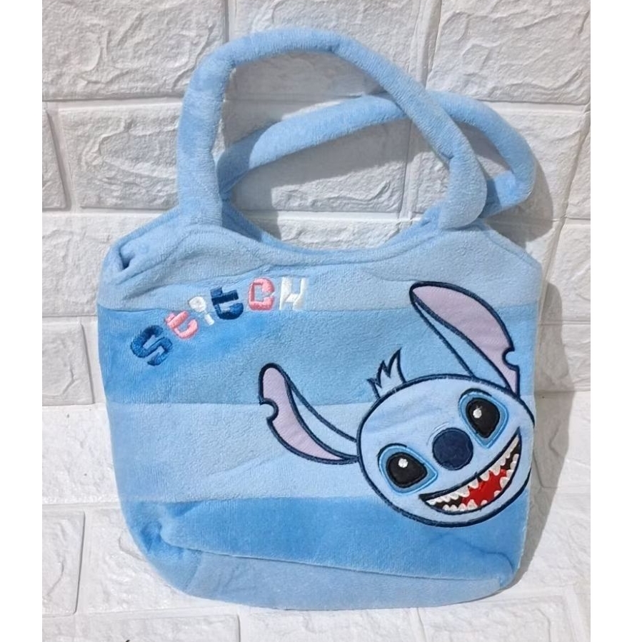 tas boneka motif karakter stitch. tas boneka bulu lembut retsleting