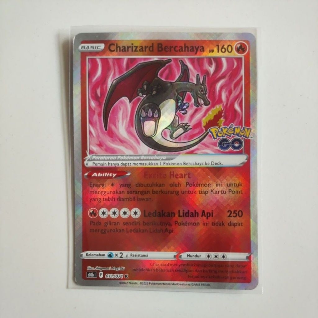 Kartu pokemon charizard bercahaya pokemon go