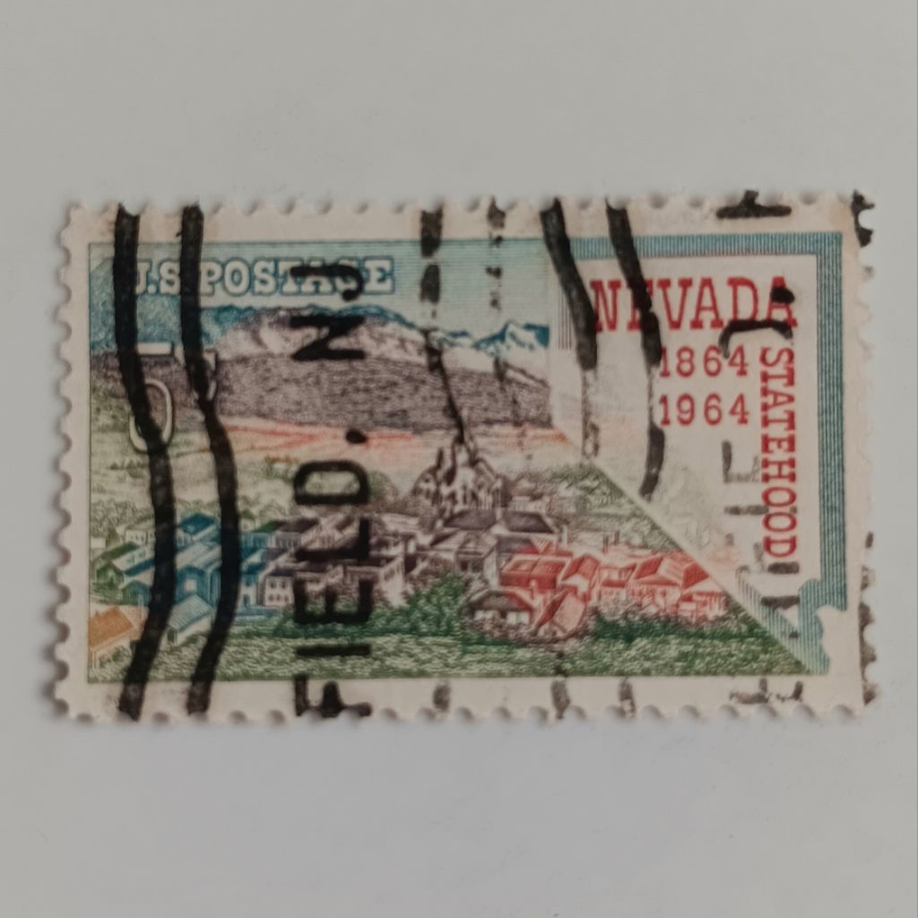 

(AA) Perangko Amerika Serikat 1964 Statehood Nevada - Centennial Nevada Statehood, Virginia City and Map of Nevada 5c Used