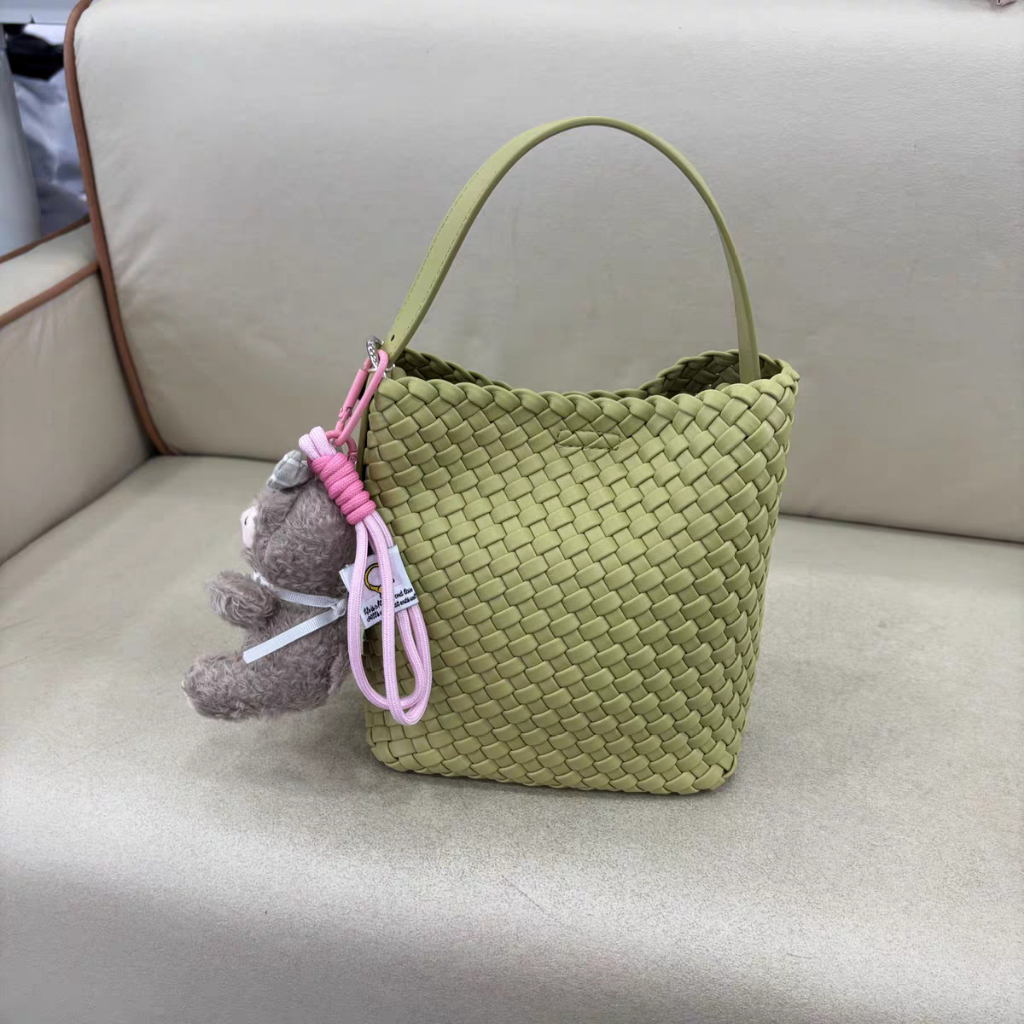 Miniatur merajut wanita.Keanggunan kulit tali tas