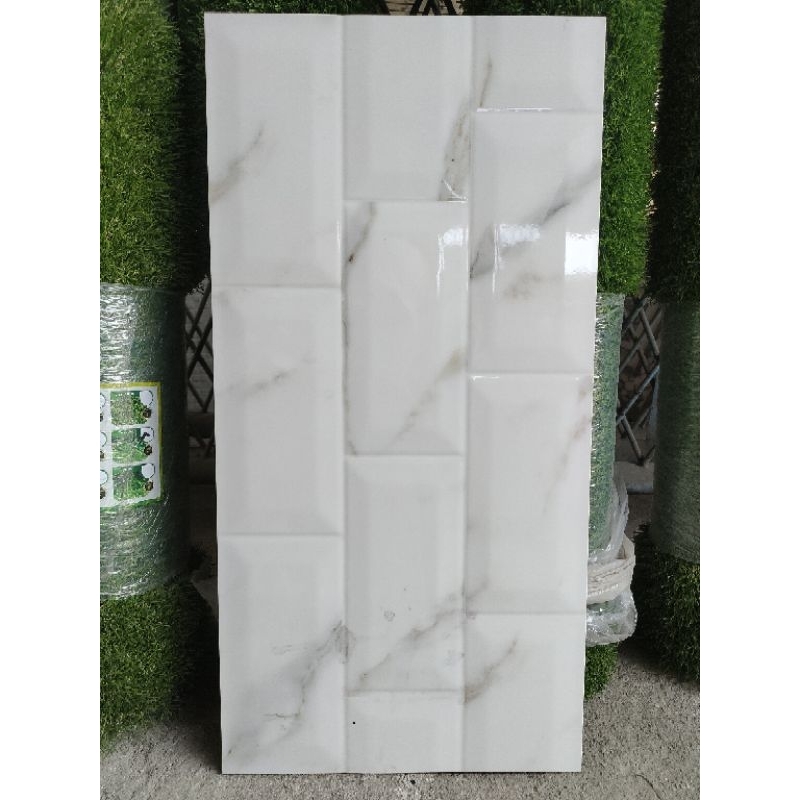 KERAMIK 30x60 BEVEL BATA MOTIF CARARA CUTTING GRANIT