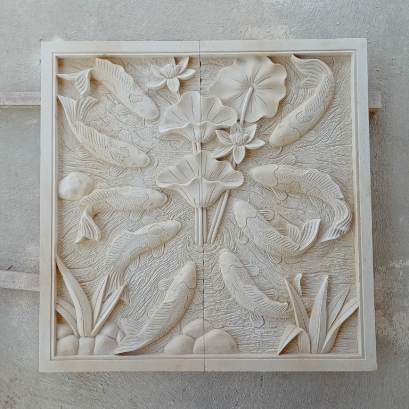 ukiran batu paras motif ikan koi