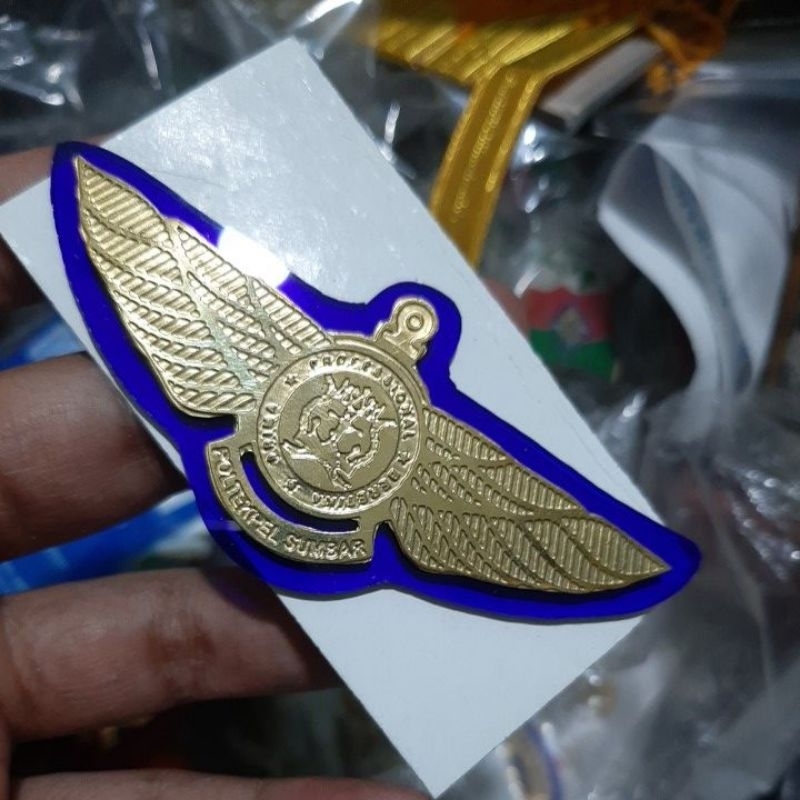 wing poltekpel sumbar biru