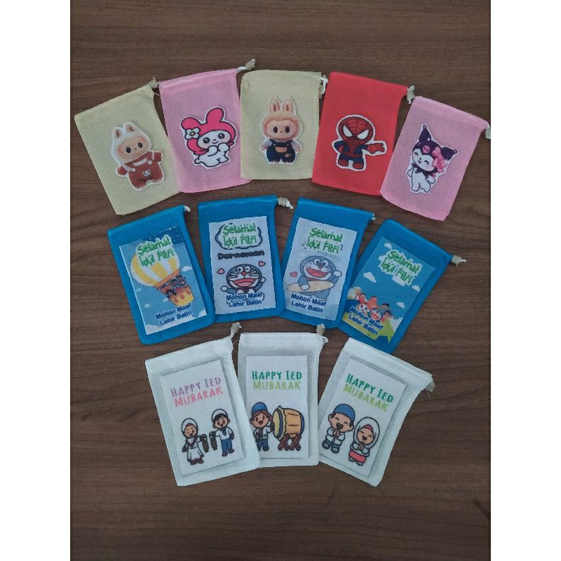 

Amplop kain serut angpau lebaran bisa pilih karakter
