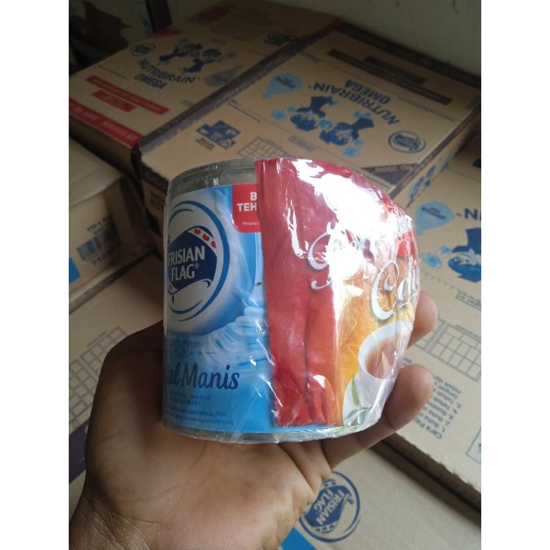 

susu kaleng Frisian flag bonus 1 sachet teh sosro