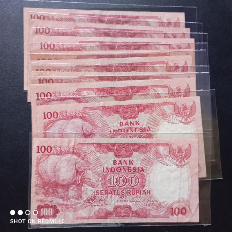 uang kertas kuno 100 badak tahun 1977 bekas beredar asli