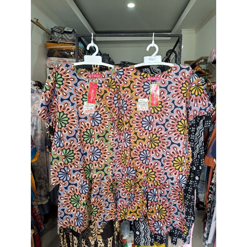 setelan celana pendek kencana ungu