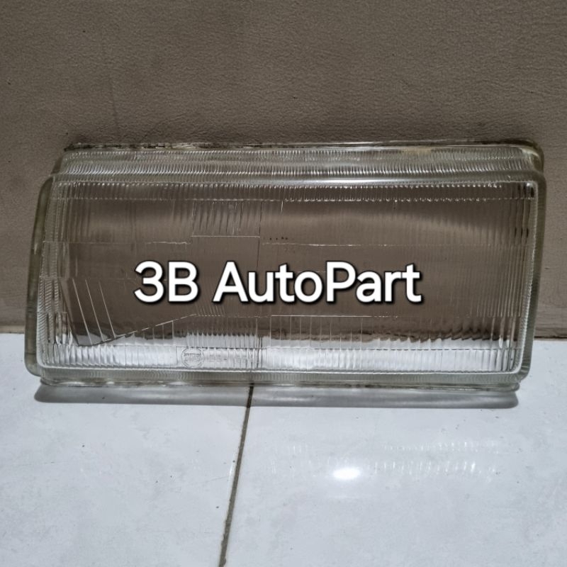 Kaca headlamp lampu depan Ford laser kiri merk TYC