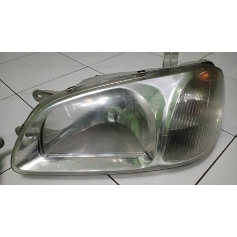 headlamp kia carnival taun 2000