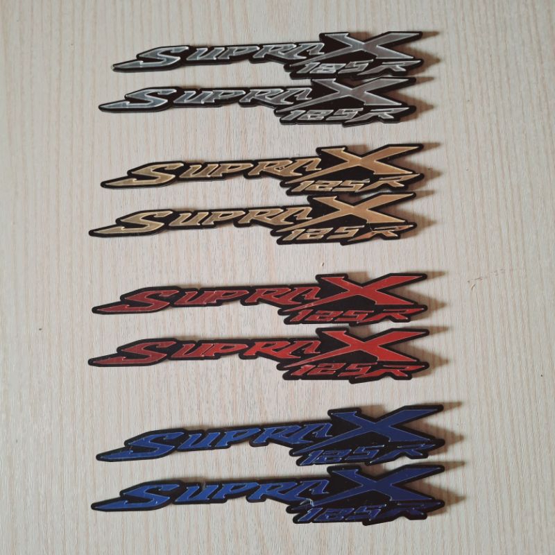 emblem timbul acrilic tulisan Supra X 125 sepasang