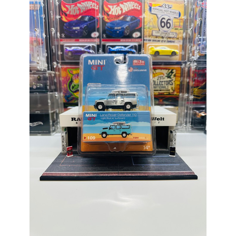 Mini GT CHASE No 109 Land Rover Defender 110 Light Blue w/ Surfboard Mijo Exclusive