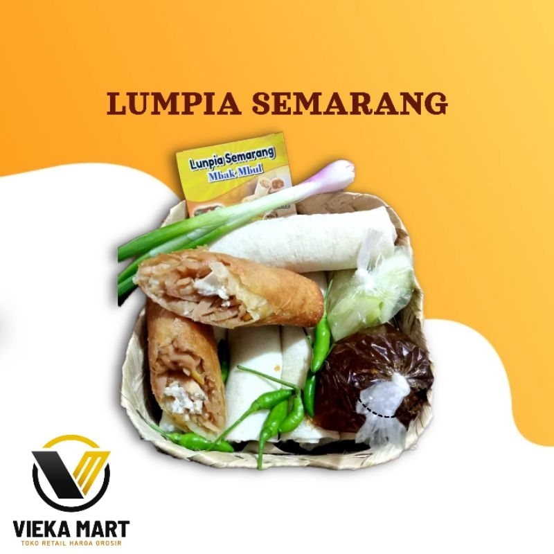

Lumpia Semarang Premium isi 10 dikemas dengan besek dan saus, acar, daun bawang, dan cabe hijau