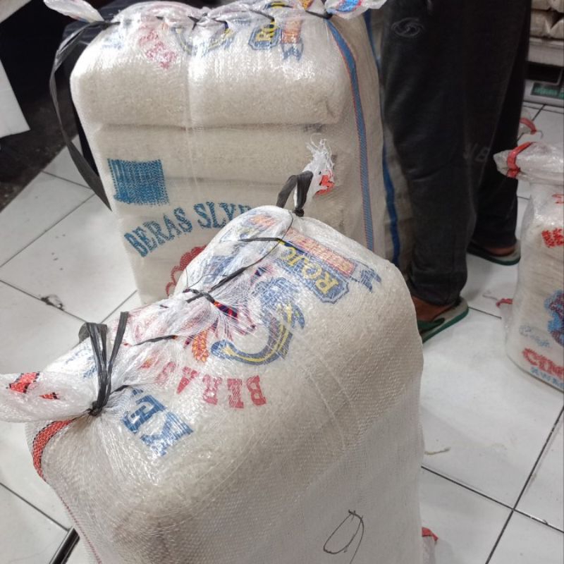 

HG Beras Merah Cap TOPI TANI