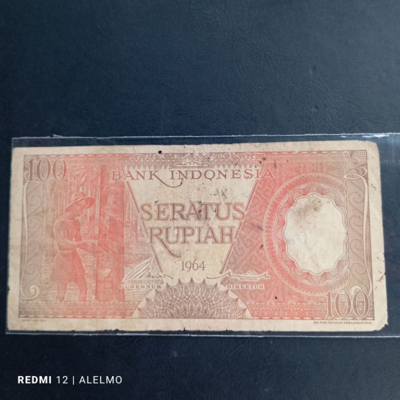 uang kertas kuno 100 rupiah pekerja tahun 1964 bekas asli jelek