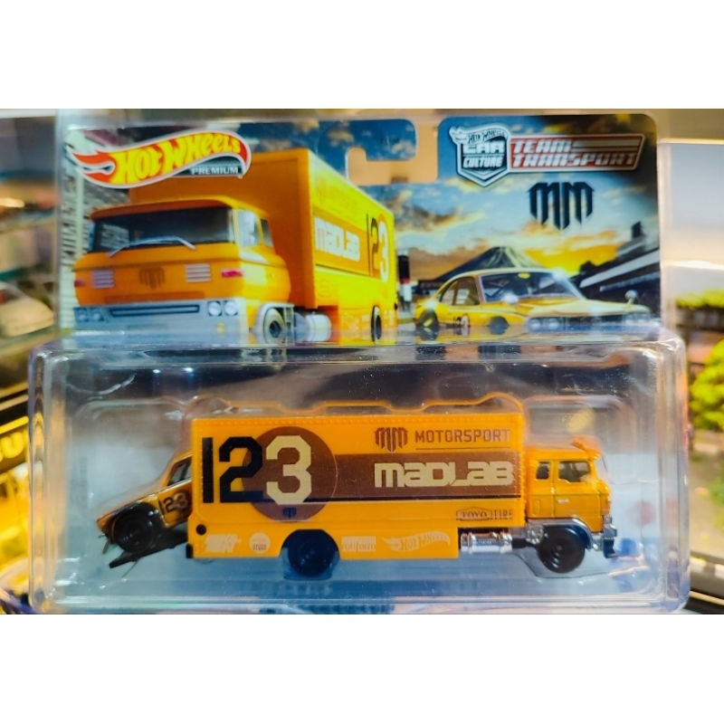 Hotwheels Premium Team Transport Mad Mike Mazda RX3 Sakura Sprinter