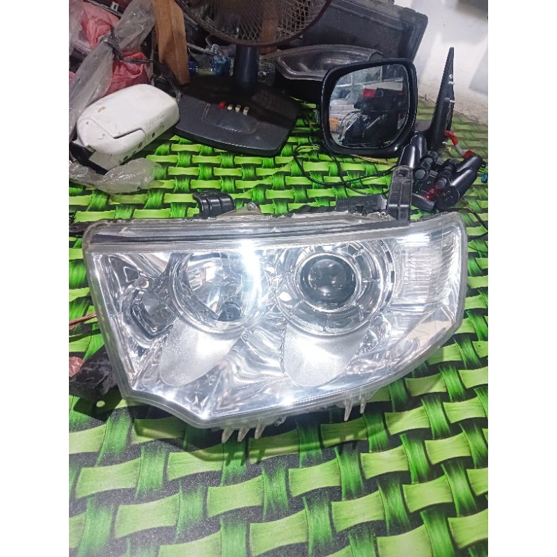 headlamp pajero dakar sport2010- 2014 original