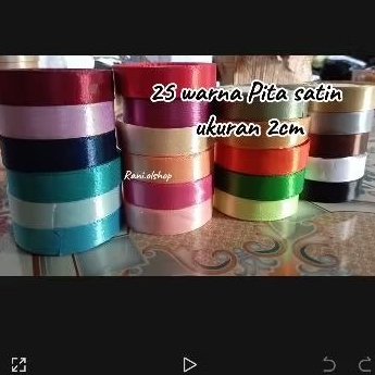 

1 roll PITA SATIN 3/4 atau 2CM lengkap . 1 Roll 20 - 25 yard. Souvenir hampers kain polos parcel