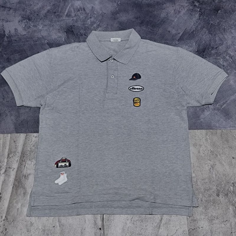 Baju kaos kerah pria Ellesse abu motif