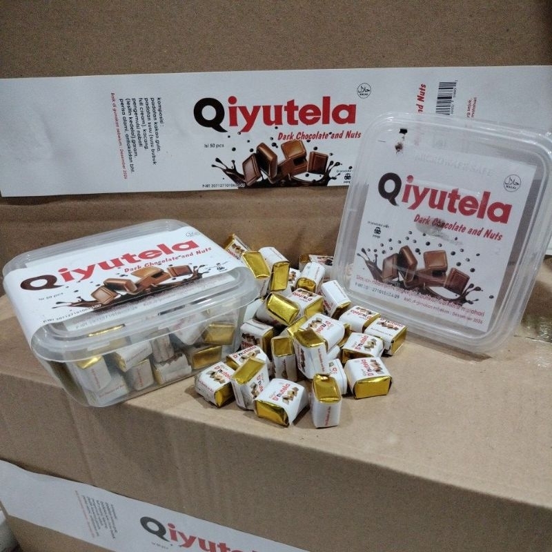 

Qiyutela dark chocolate and nuts cube isi 50 pcs