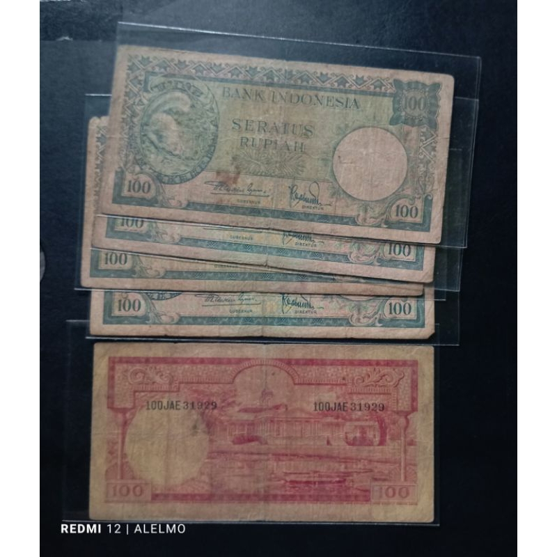 uang kertas kuno 100 rupiah tupai tahun 1957 bekas asli
