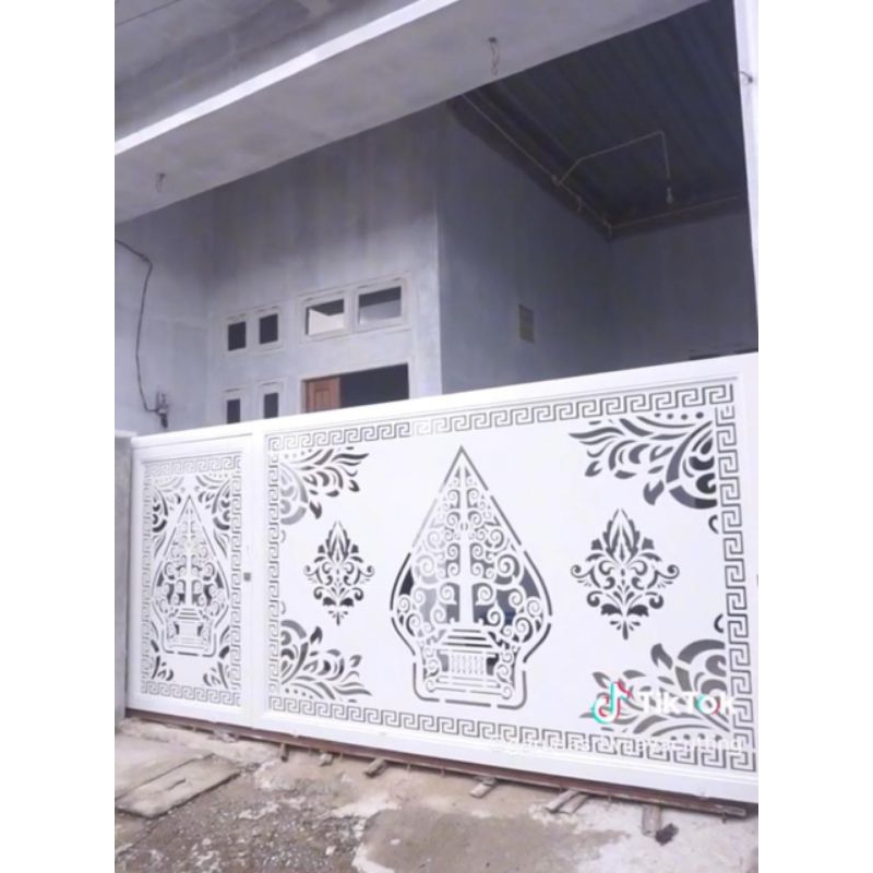 pagar cating laser motif wayang