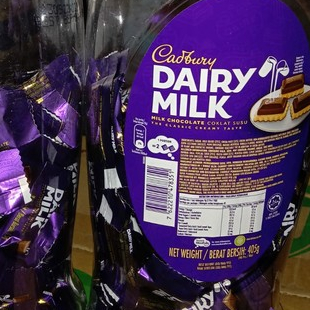 

CEMILAN COKLAT CADBURY DAIRY MILK TOPLES TERBAIK 405 GRAM