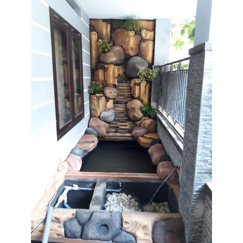 Taman relief tebing kolam ikan