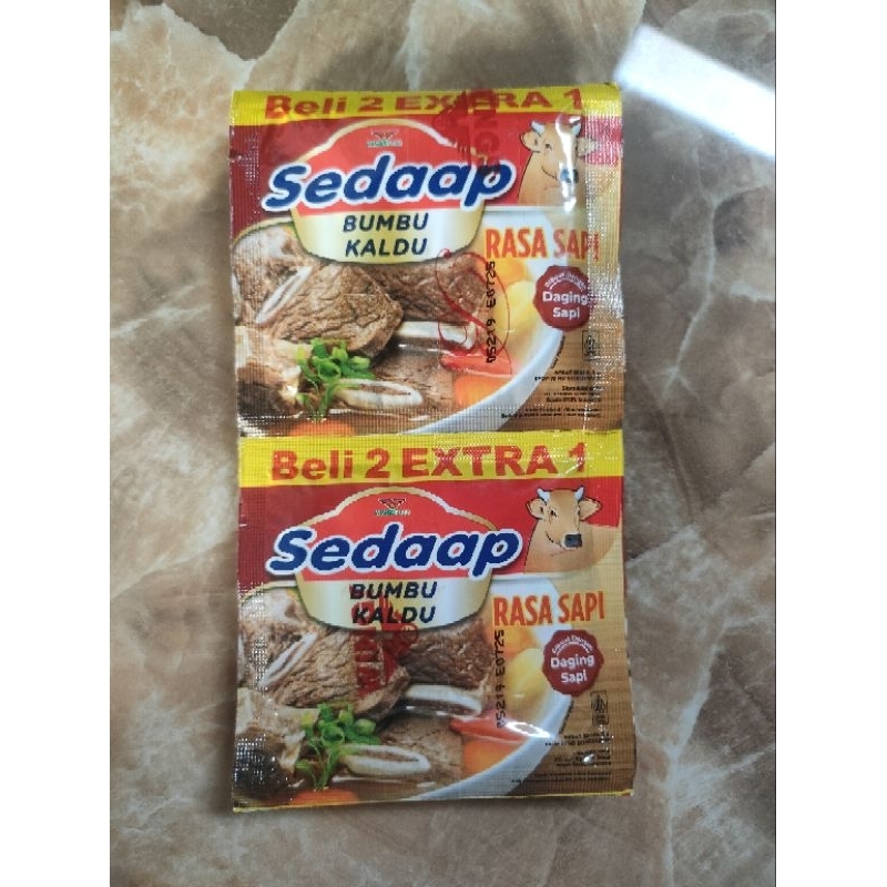 

Bumbu kaldu sapi sedaap 1 renceng isi 9 sachet 100g