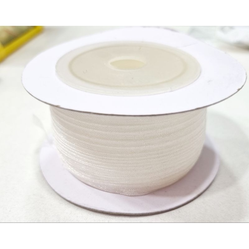 

Pita organdi 1/8 inch/ 0.3cm 45 meter/roll.