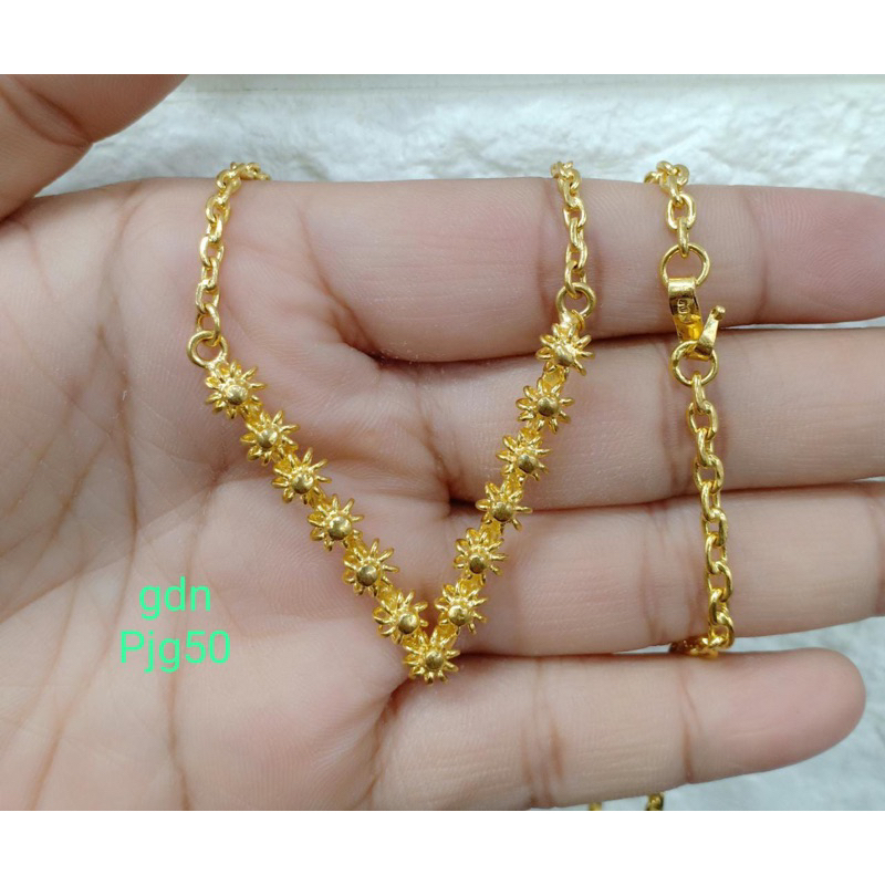 Kalung bunga tanjung, replika emas mewah