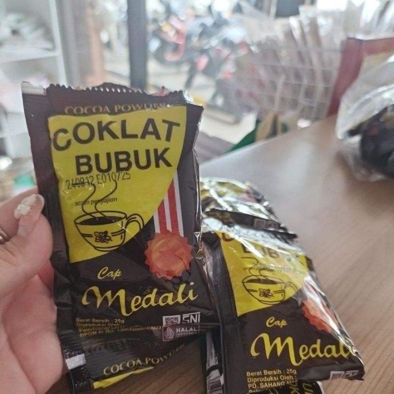 

COKLAT BUBUK CAP MEDALI 25G