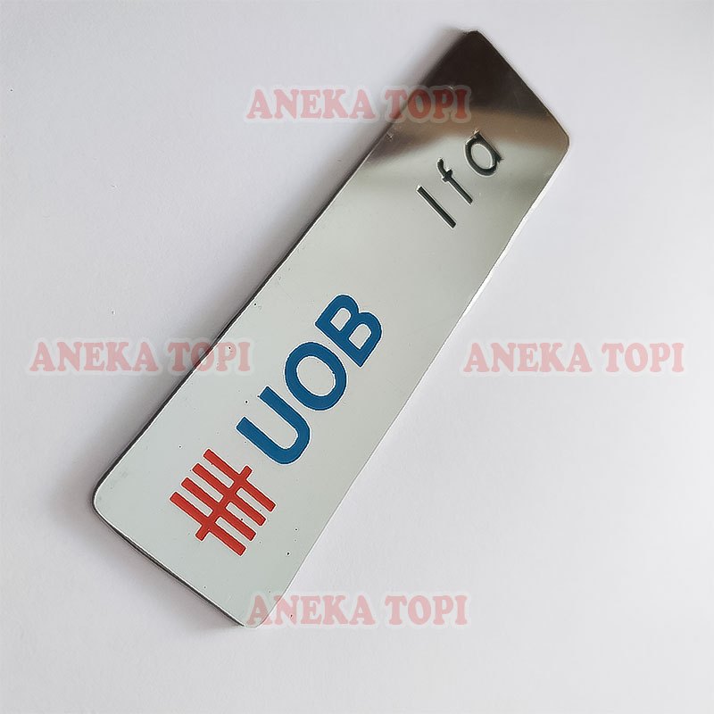 

Name Tag UOB Bahan Logam Papan Nama Logo Custom - Aneka Topi
