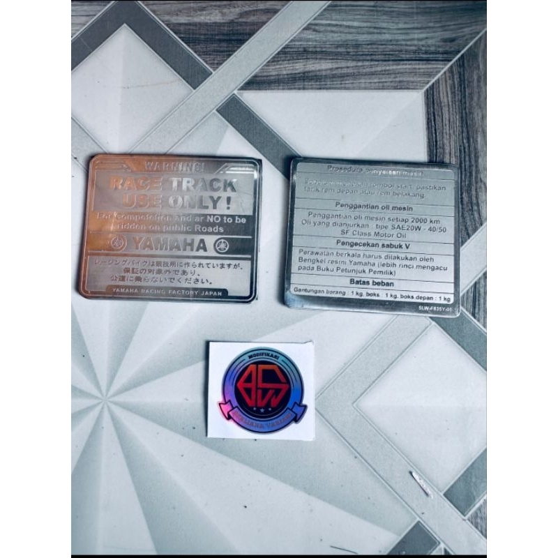 emblem stainles warning Emblem warning dashboard mio