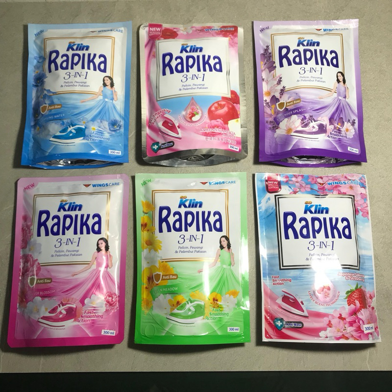 SO KLIN RAPIKA 3 IN 1 UKURAN 300 ML PELICIN PEWANGI PELEMBUT PAKAIAN WINGS CARE SOKLIN