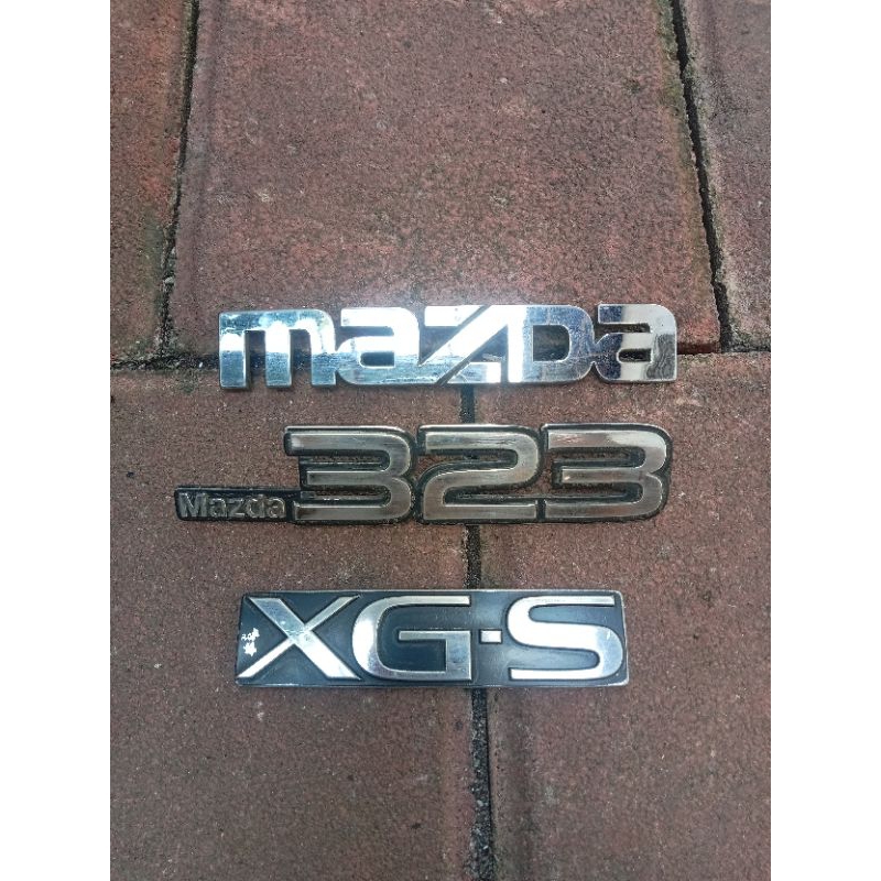 Emblem Mazda 323