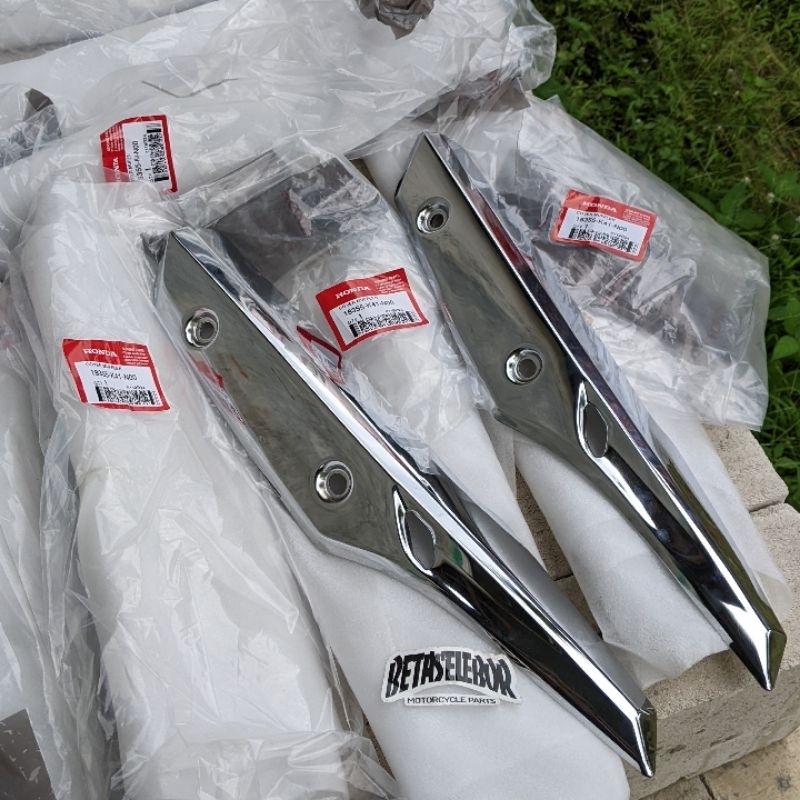 COVER KNALPOT SUPRA X 125 FI ORIGINAL