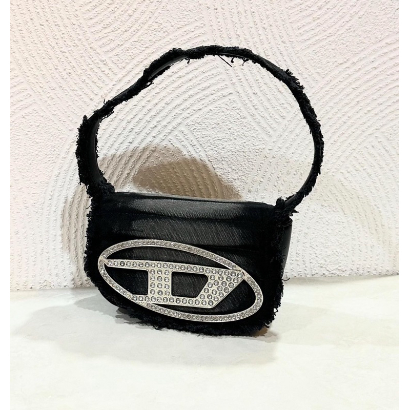 diesel bag ripped jeans