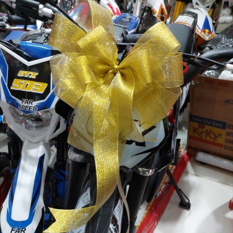

Pita hadiah untuk mobil, kulkas, sepeda motor