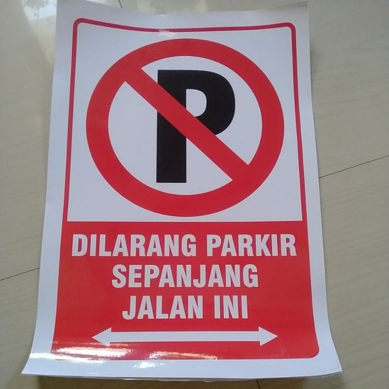 stiker dilarang parkir di sepanjang jalan ini