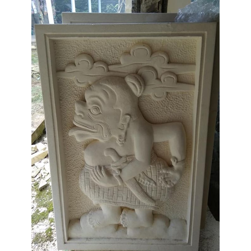 ukiran batu alam motif wayang